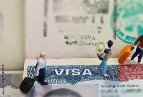 Cuadro en lienzo Miniature toys studio set up - expatriate business man and other travellers travel with visa on passport as background