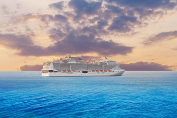 Luxury cruise ship vacation in blue azure sea sky with clouds sunset. Concept travel background