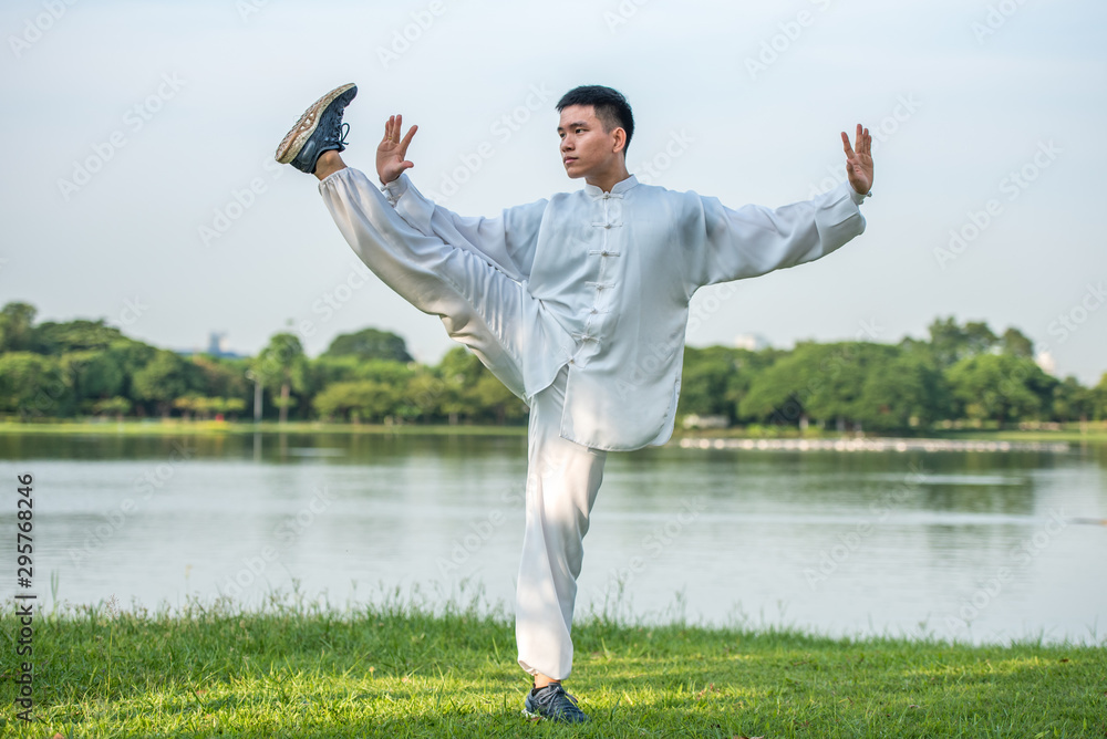 Tai Chi Chuan Master workout in the park, Chinese Martial Arts workout.  Photos | Adobe Stock