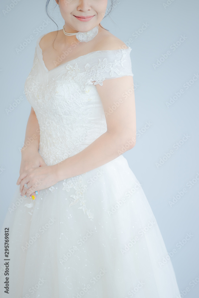 Close up of The beautiful bride in wedding dress smiled happily Close up of The beautiful bride in wedding dress smiled happily