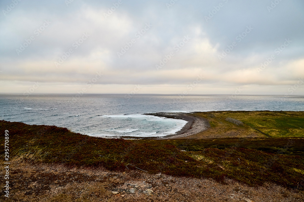 Norway landscape with beach of the Northern sea in cloudy weather