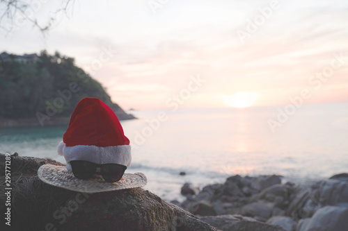 Christmas Santa hat on the beach. are texture Nature background creative tropical layout made at phuket Thailand