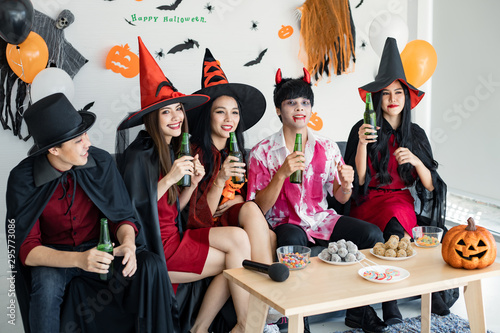 Gang of young Asian with celebrate Halloween party for dance and drink and drunk in the room.