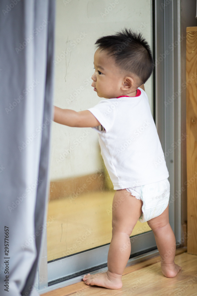 Adorable infant baby boy in cozy room Adorable infant baby boy in cozy room