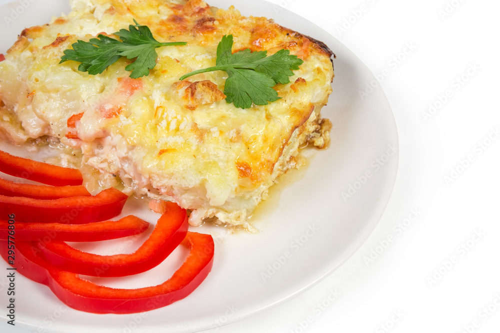 Cauliflower and seafood gratin portion, red bell pepper slices Cauliflower and seafood gratin portion, red bell pepper slices