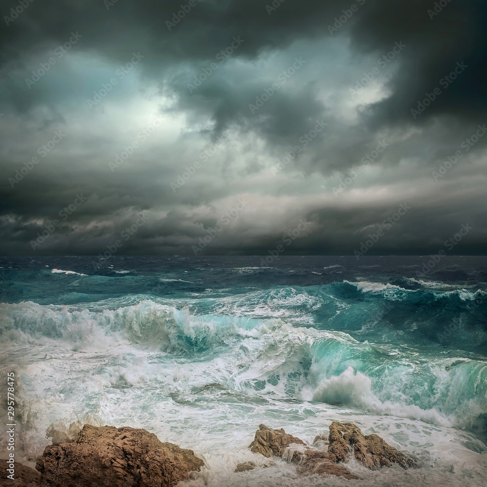 Stormy sea view near coastline at evening time. Waves, splashed Stormy sea view near coastline at evening time. Waves, splashed