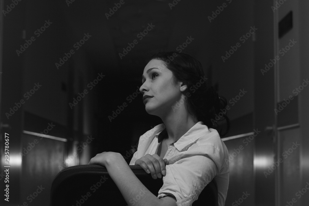 black and white photo of a girl in an evening dress with beautiful hands on a dark background black and white photo of a girl in an evening dress with beautiful hands on a dark background