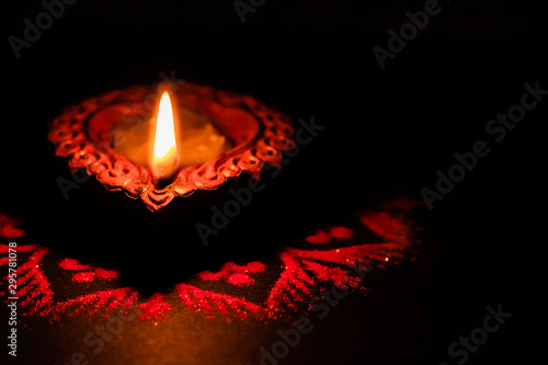 Top View of a crafted clay lamp with black background and copy space - Diwali concept
