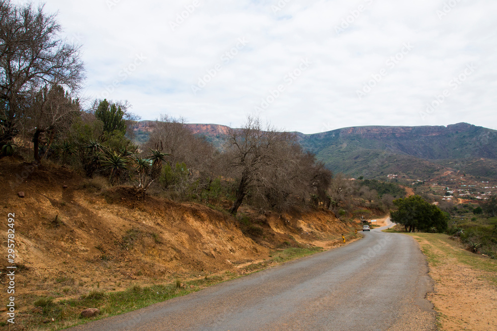 Fototapeta premium Rural Road Heading Downhill into Valley in Kwazulu-Natal