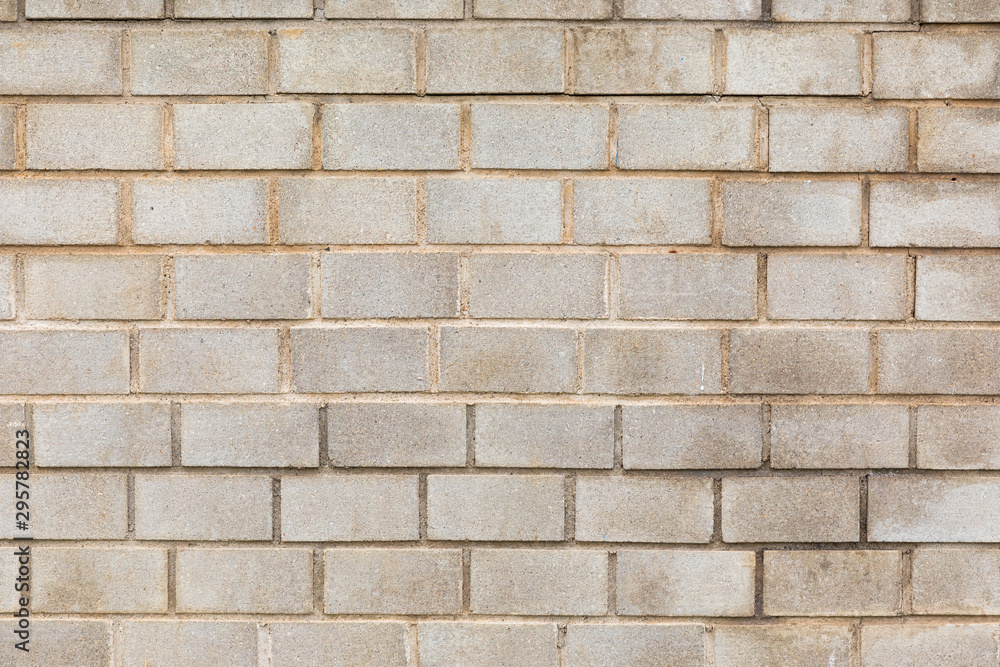 Gray concrete brick wall with dirty surface, for backdrop or house exterior design Gray concrete brick wall with dirty surface, for backdrop or house exterior design