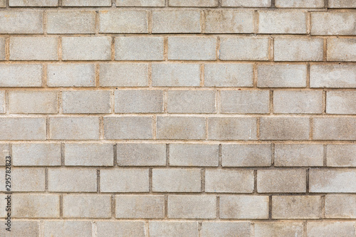 Gray concrete brick wall with dirty surface, for backdrop or house exterior design