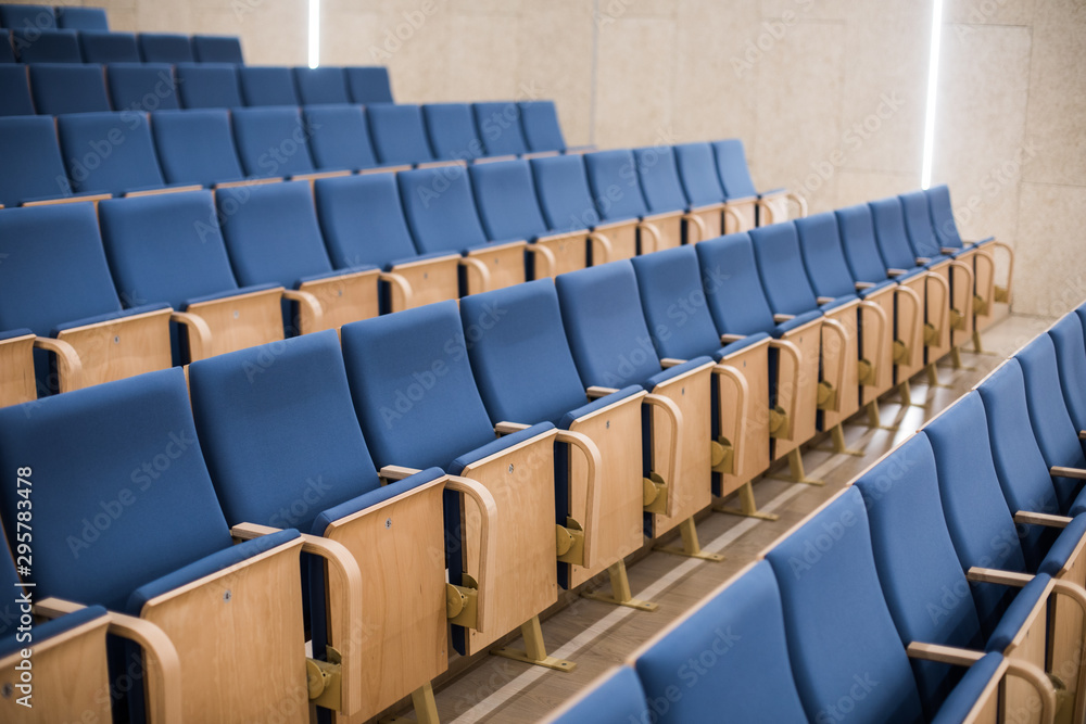 Naklejka premium Empty blue seats in a conference room