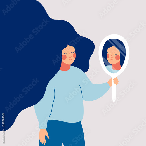 Sad young woman looks on her reflection in mirror with sorrow. Cartoon flat style photo