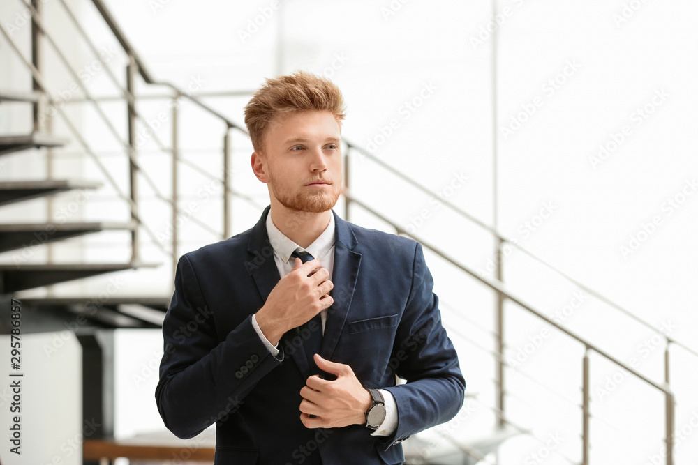 Portrait of handsome young man in elegant suit indoors Portrait of handsome young man in elegant suit indoors