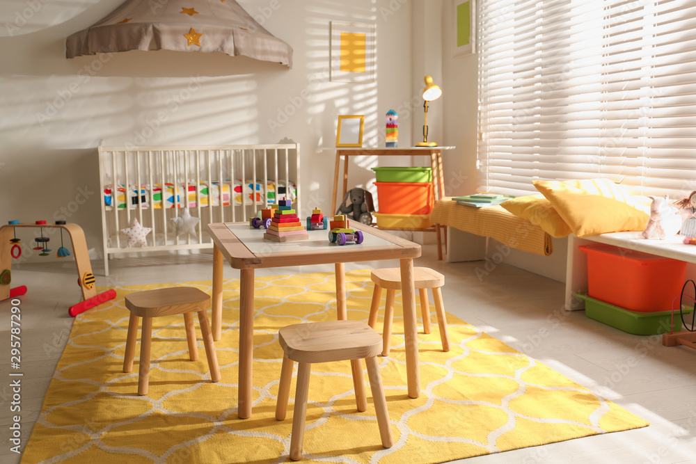 Cozy baby room interior with comfortable crib Cozy baby room interior with comfortable crib