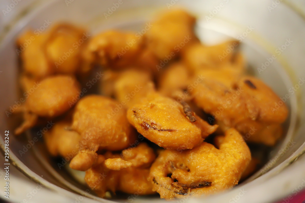 Homemade Indian potato and onion pakoda or Bhajji famous evening snacks Homemade Indian potato and onion pakoda or Bhajji famous evening snacks