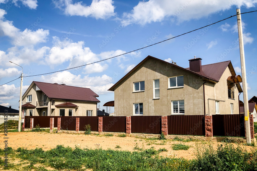 Country houses under construction on green field. Country houses under construction on green field.