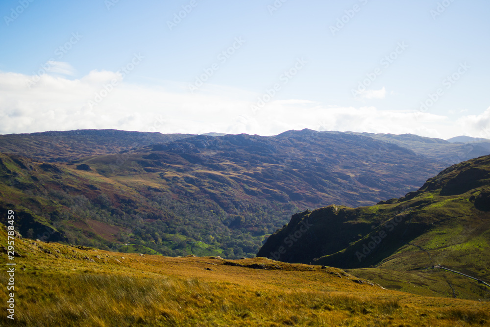 Landscape in Snowdonia National Park. Mountains and meadows in a sunny day