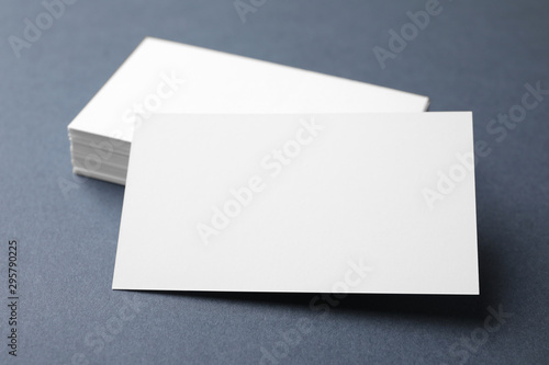 Blank business cards on dark grey background, closeup. Mock up for design © New Africa