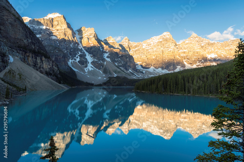 Beautiful sunrise over turquoise water of Moraine lake in the Rocky mountains, Banff National Park, Canada.