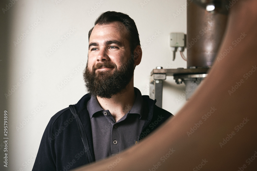 Man working at a distillery Man working at a distillery