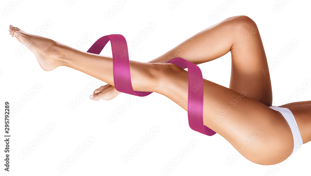 Women's legs with pink ribbon. Physical rehabilitation concept. - obrazy, fototapety, plakaty 