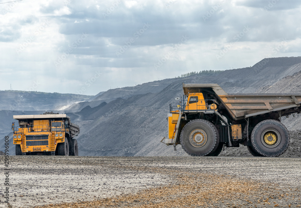 Obraz premium Rock transportation by dump trucks.