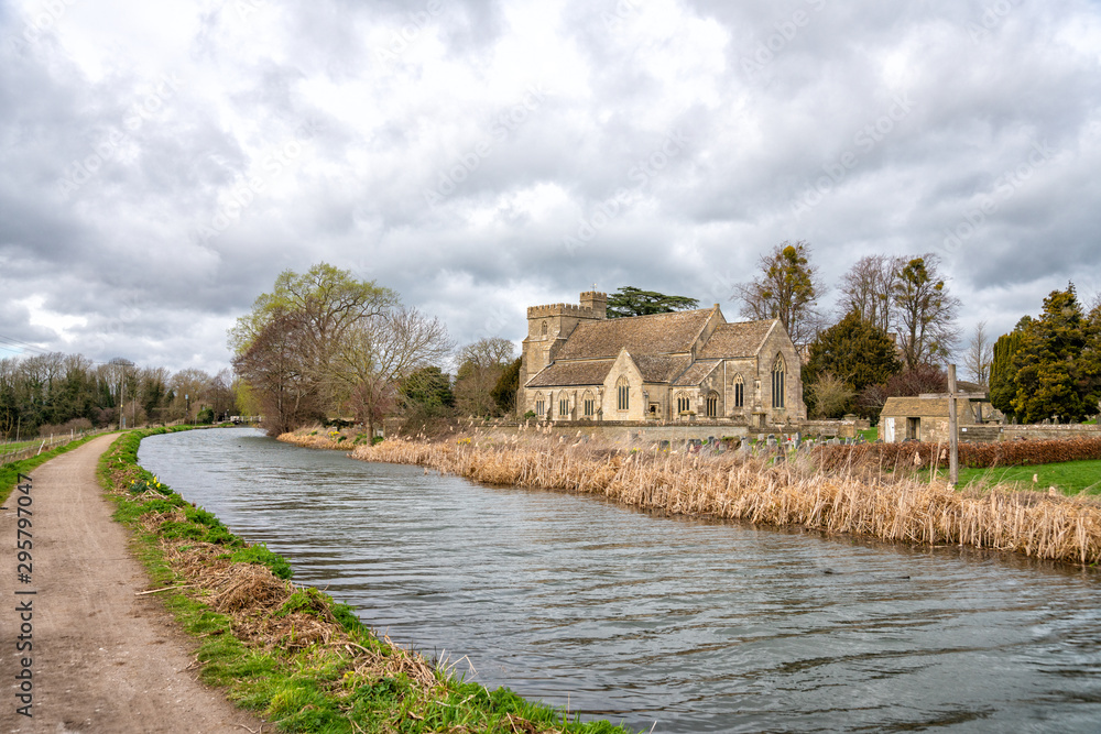 The Stroudwater Navigation with the Church of St Cyr, Stonehouse near Stroud, The Cotswolds, United Kingdom