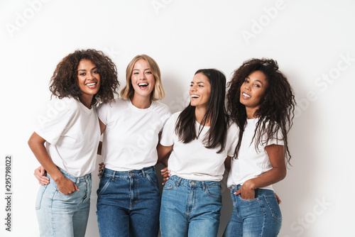 Optimistic cheery young women multiracial friends photo