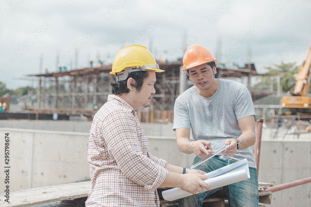 Two young man architect on a building construction site Two young man architect on a building construction site