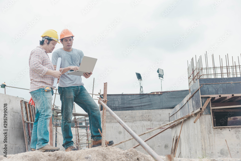 Two young man architect on a building construction site Two young man architect on a building construction site