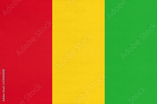 Guinea national fabric flag, textile background. Symbol of african world country.