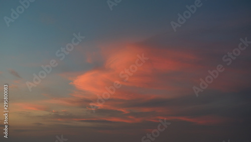 White cotton candy clouds on tropical blue sky at sunset, The horizon began to turn orange with purple and pink cloud at night, Dramatic cloudscape area