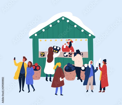 Xmas street fair kiosk flat vector illustration. Seller and customers in warm clothes cartoon characters. New year tradition, christmas eve design. People buying festive souvenirs, toys, sweets.