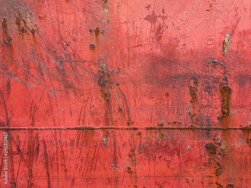 The steel cladding of the ship with welds and traces of rust is photographed under natural light in the daytime. Background picture. © Vit-Vit
