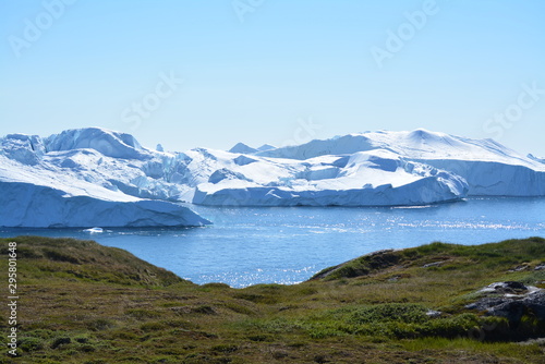 great views over ice fjord in Ilulissat Greenland - beautiful icebergs in the Disko Bay / Baffin Bay - blue sky, ice sea