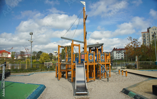 Children playground on yard in public park. Urban neighborhood childhood concept.