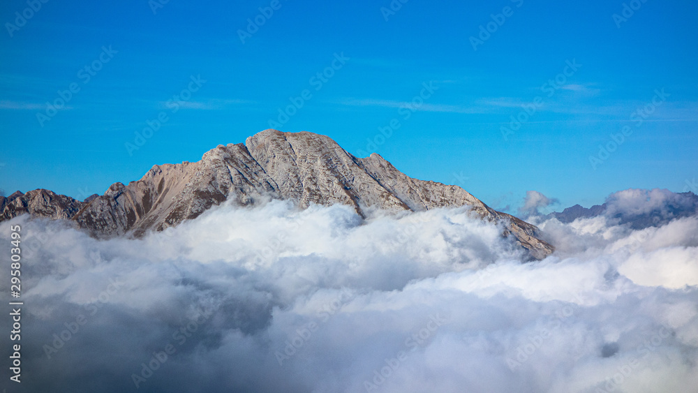 Mount Arera on the Orbie Alps above a sea of clouds