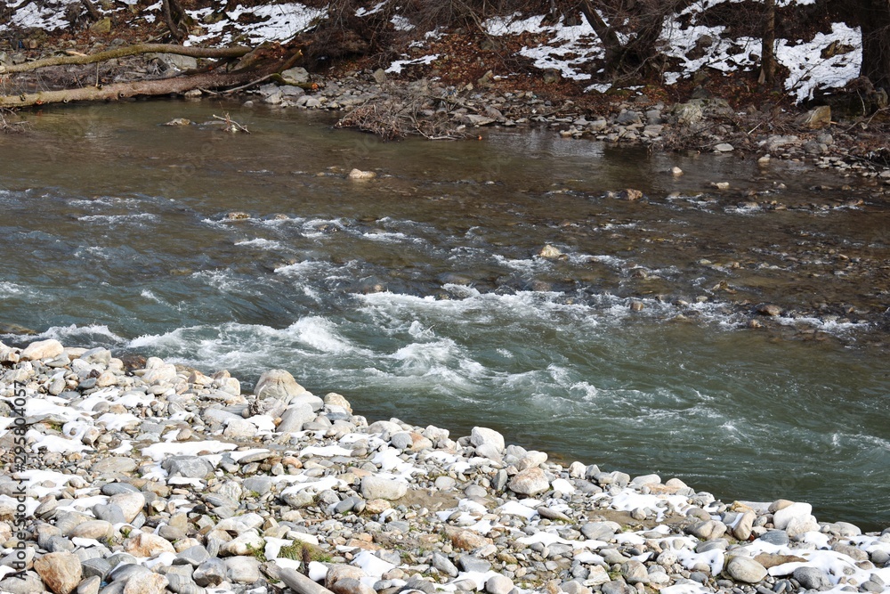 Mountain river in wintertime landscape Mountain river in wintertime landscape