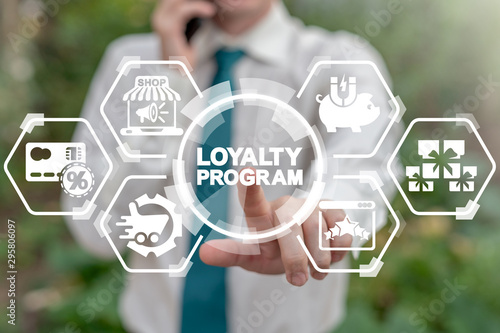 Loyalty Program Shopping Earn Points Return Money concept. Businessman touches loyalty program word's button on virtual screen. photo