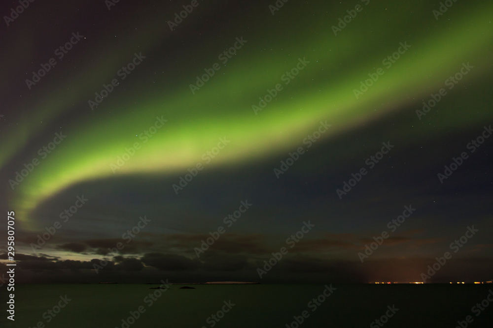 Beautiful northern lights over the Atlantic ocean. Iceland
