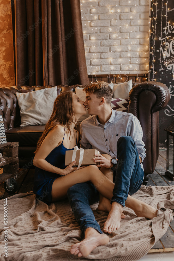 Romantic couple in love feeling happiness about their romance spending christmas eve together- Image