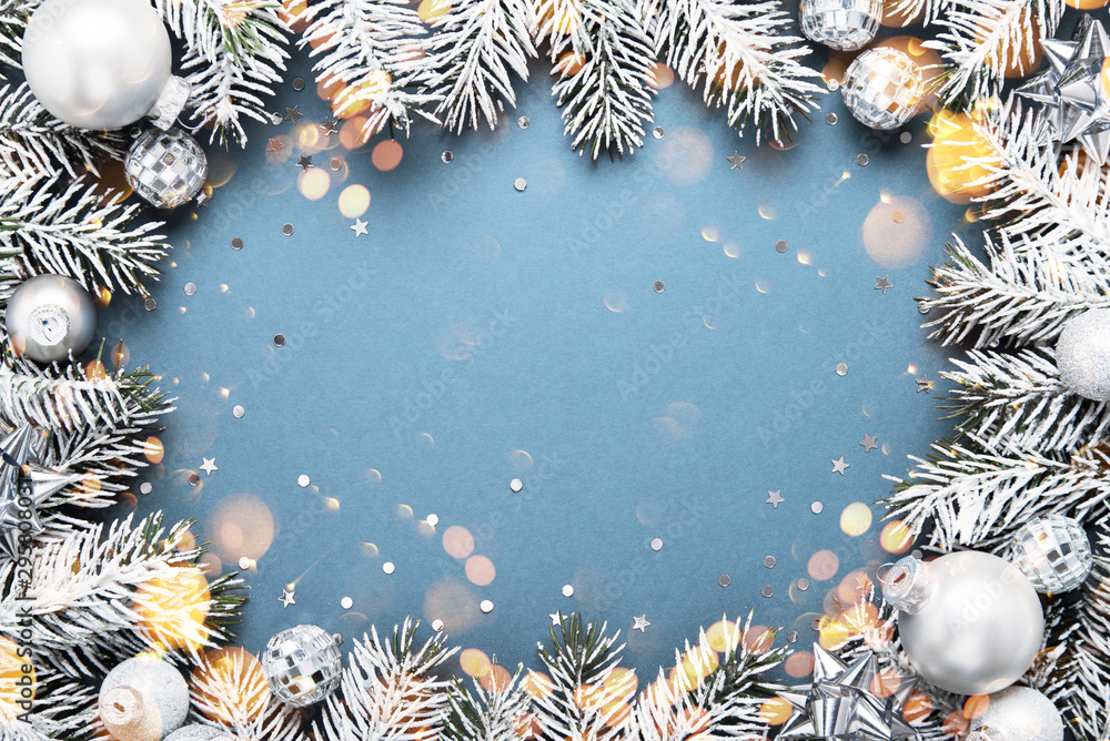 Blue Merry Christmas and Happy Holidays greeting card, frame, banner. New Year. Winter holidays. Silver ornaments. Blue Merry Christmas and Happy Holidays greeting card, frame, banner. New Year. Winter holidays. Silver ornaments.