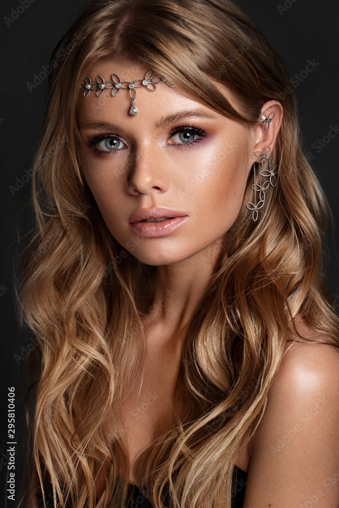 beautiful woman with perfect make up and curly long hair with original tiara beautiful woman with perfect make up and curly long hair with original tiara