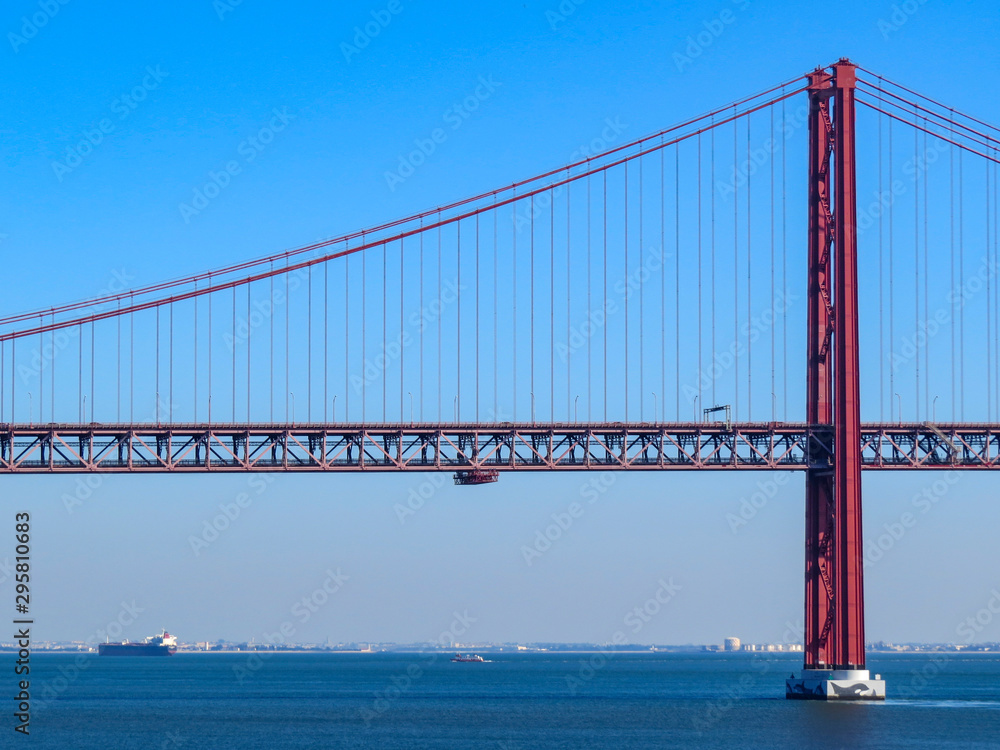 Obraz premium 25th April Bridge in Lisbon, Portugal. Famous landmark on river Tagus.