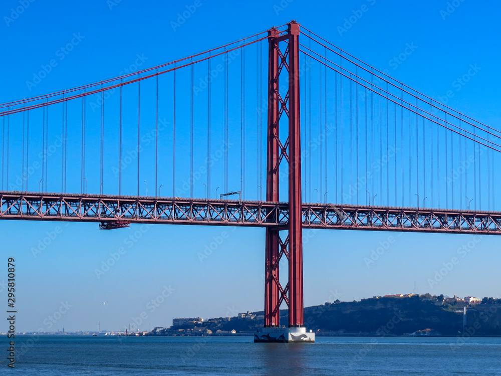 Fototapeta premium 25th April Bridge in Lisbon, Portugal. Famous landmark on river Tagus.
