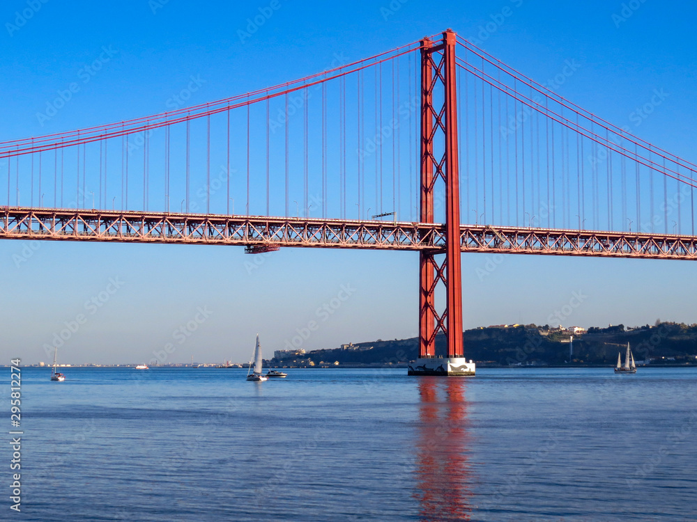 Fototapeta premium 25th April Bridge in Lisbon, Portugal. Famous landmark on river Tagus.