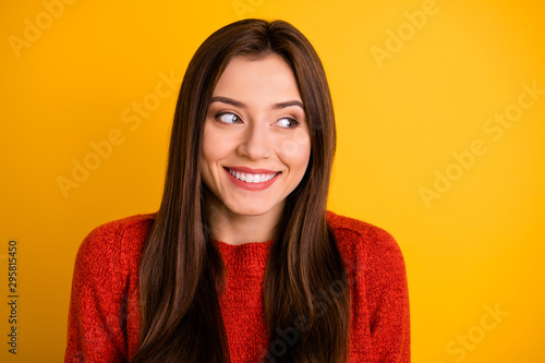 Close up photo of cheerful cute nice lovely girlfriend looking tenderly away smiling toothily isolated over yellow vivid color background
