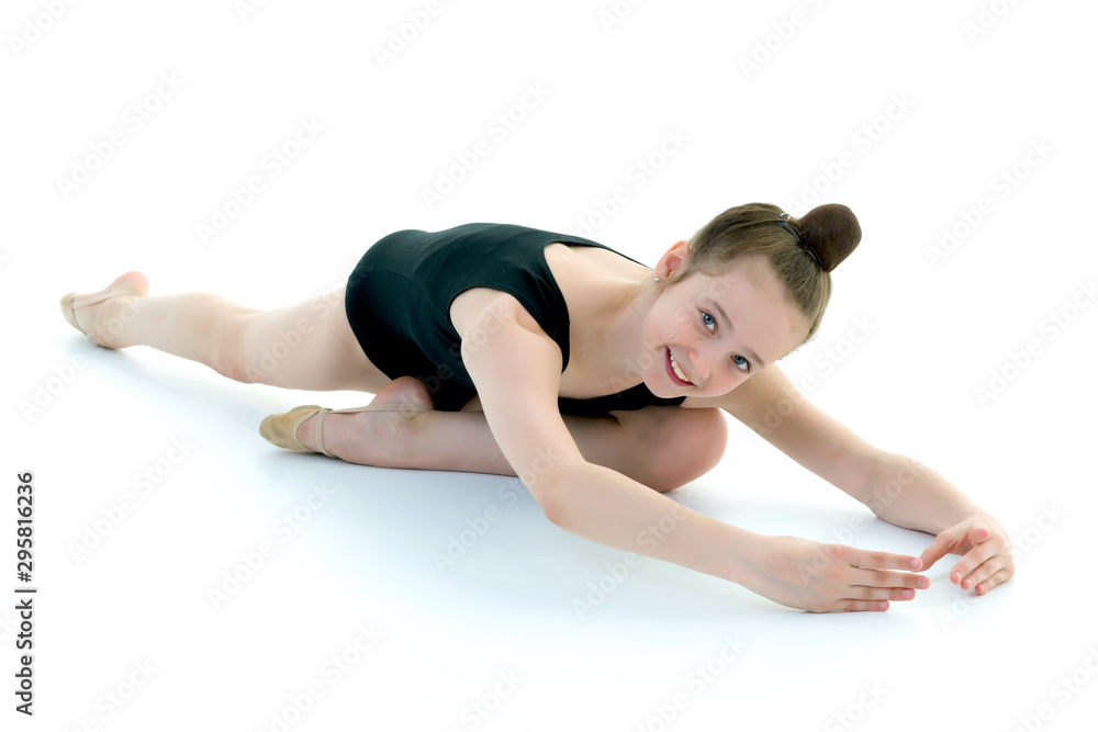 The gymnast perform an acrobatic element on the floor. The gymnast perform an acrobatic element on the floor.