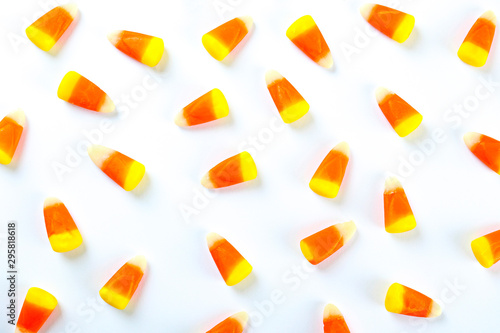 Foto Bunch of candy corn sweets as sybol of Halloween hoiday on textured background with a lot of copy space for text